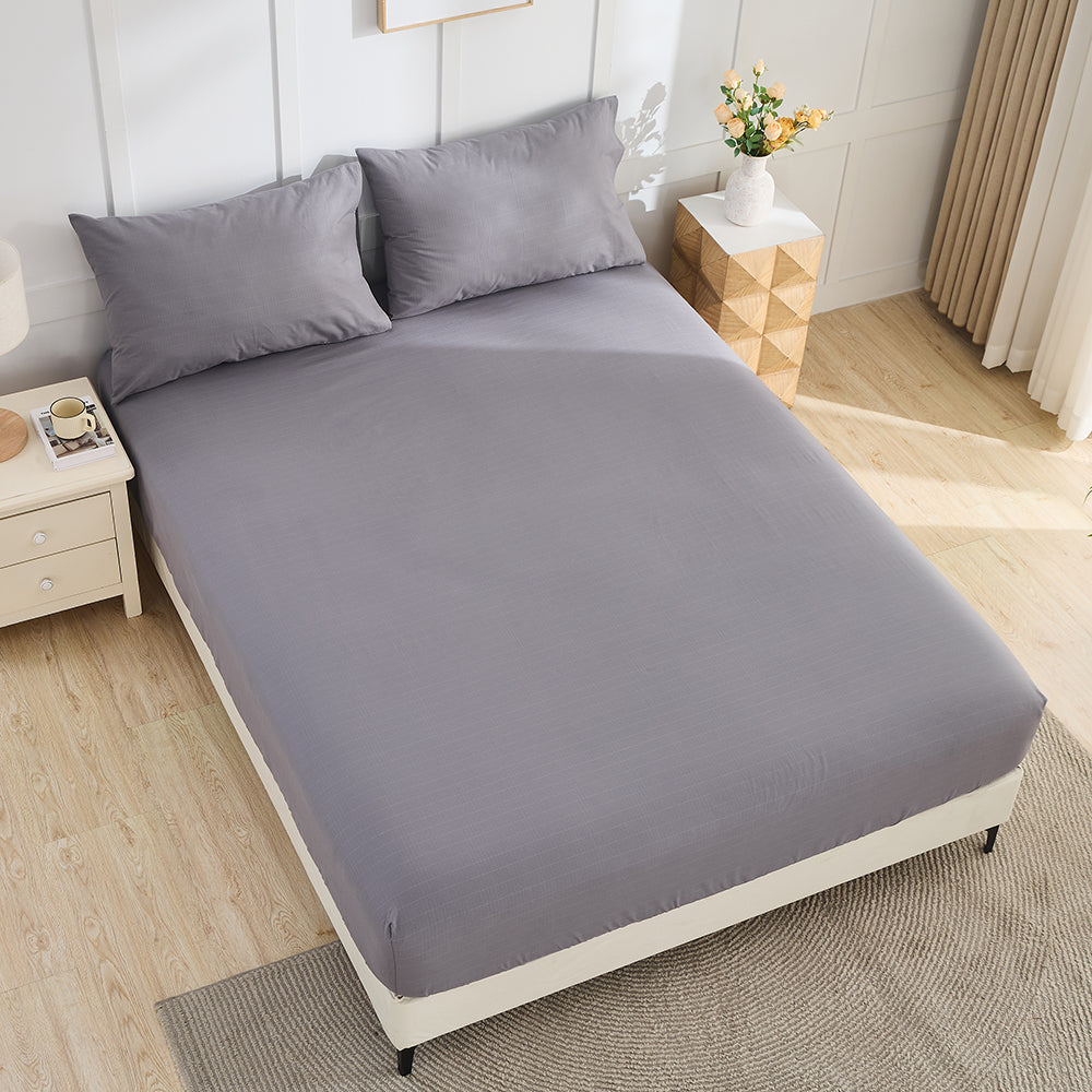 Earth grey organic grounding fitted sheet on bed – luxury earthing bedding by Terra Solum