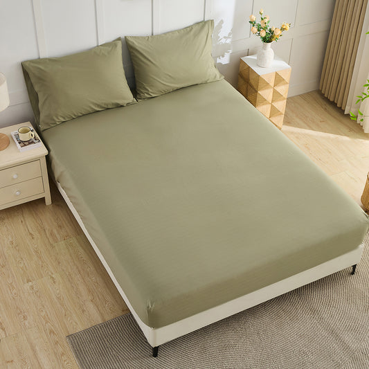 Olive green organic grounding fitted sheet on bed – luxury earthing bedding by Terra Solum