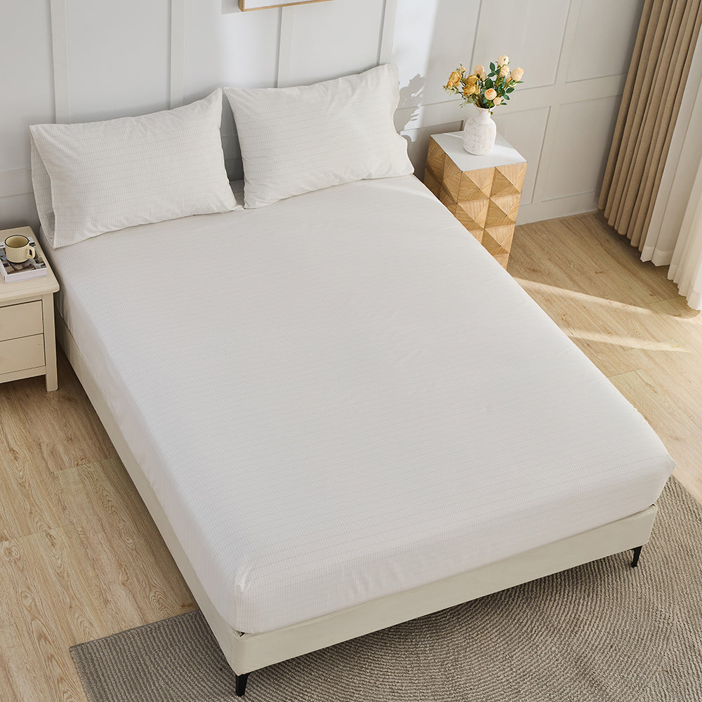 Pure white organic grounding fitted sheet on bed – luxury earthing bedding by Terra Solum